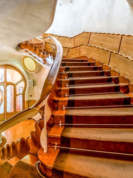 Casa Batlló interior staircase with unique wooden design, Barcelona.