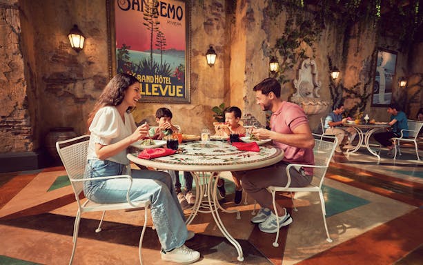 Family dining at an Italian-themed restaurant in Ferrari World Abu Dhabi.