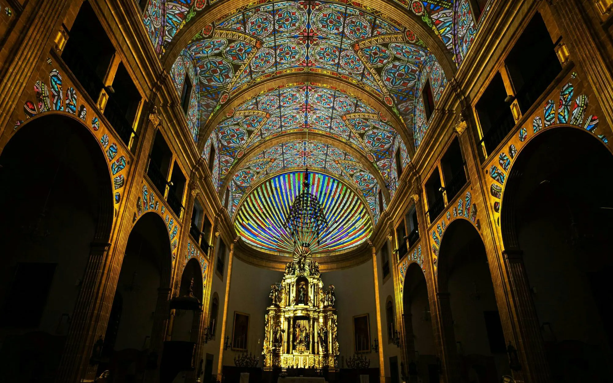 Stained glass ceiling and ornate altar at the Elements show in Església dels Sagrats Cors, Palma de Mallorca.