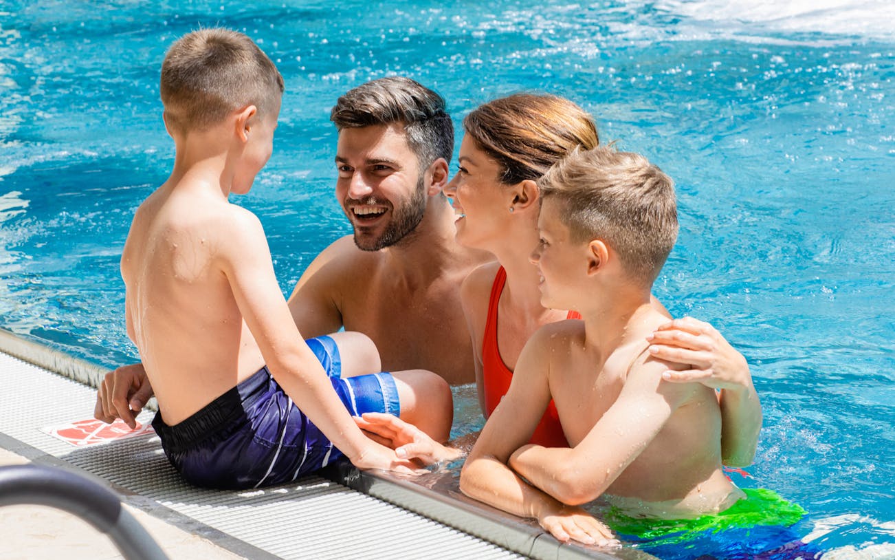 Family enjoying a swim in the Danube Delta