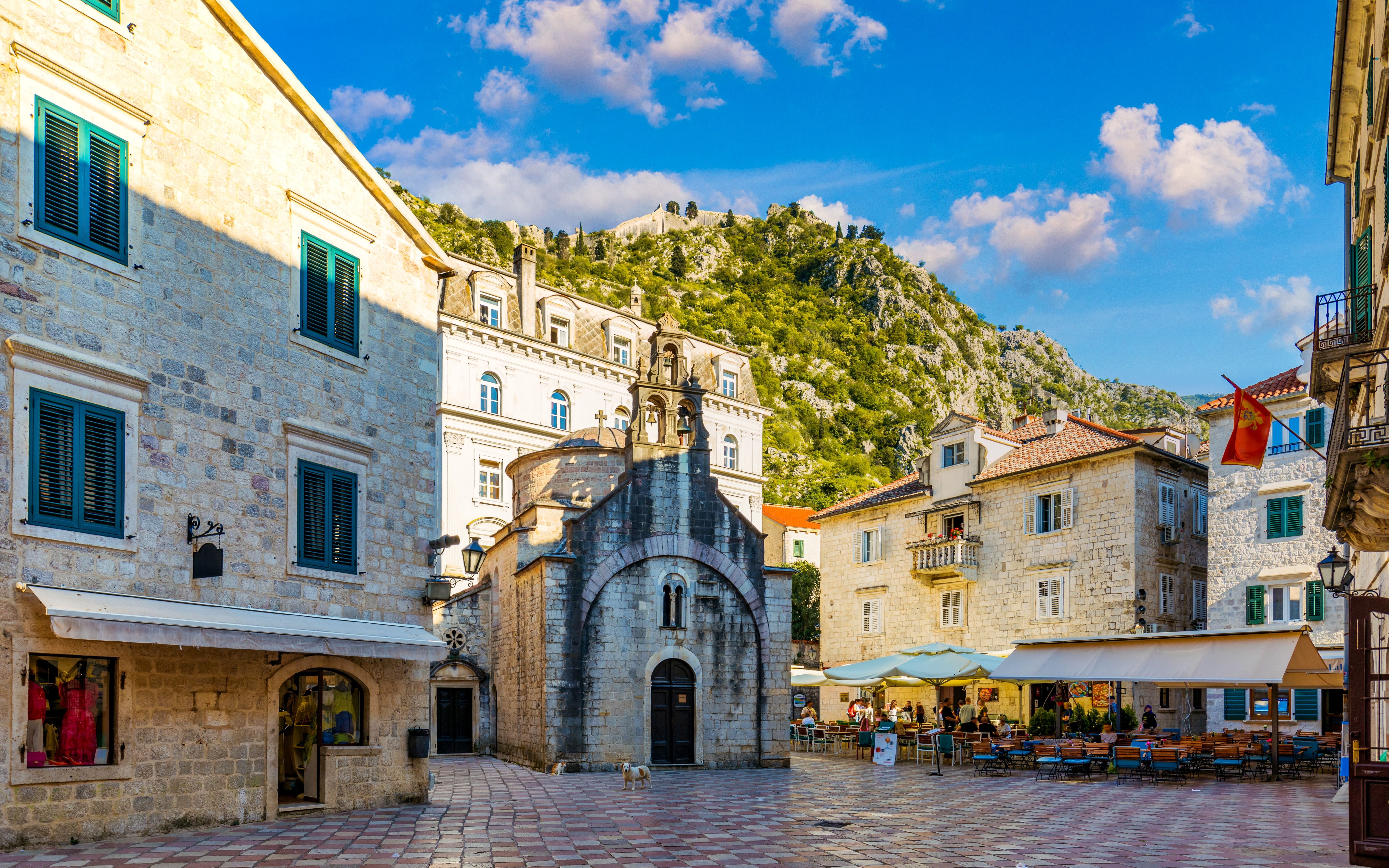 St. Luke's Square in Kotor's Old Town with historic buildings and a small church.