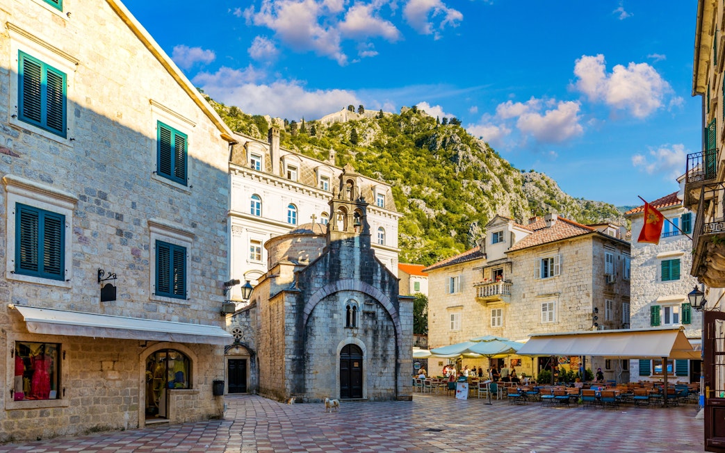St. Luke's Square in Kotor's Old Town with historic buildings and a small church.