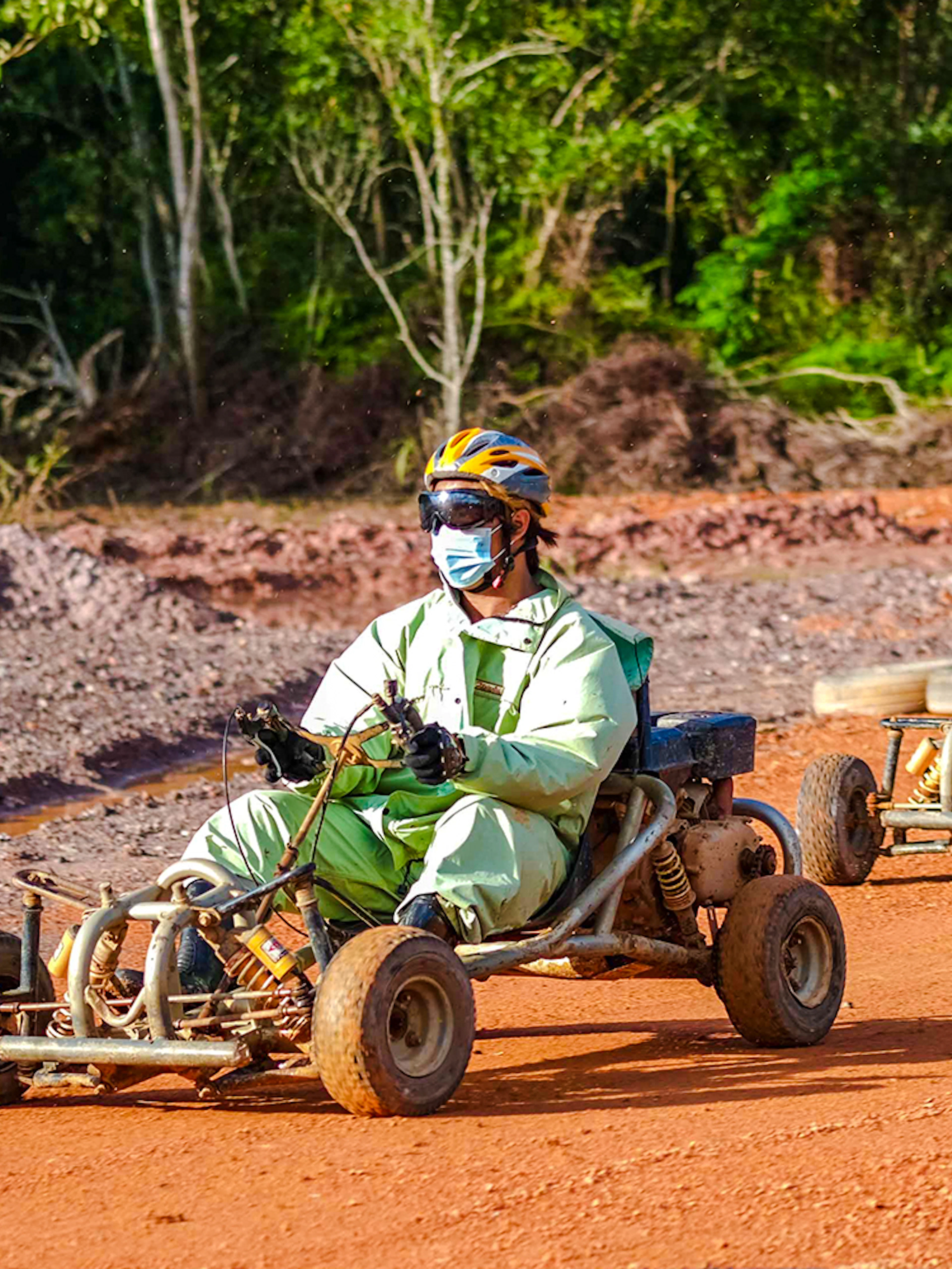Go-karting on a dirt track at Batam Adventure Park.
