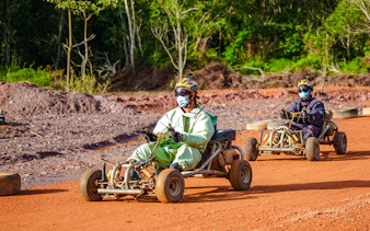 Go-karting on a dirt track at Batam Adventure Park.