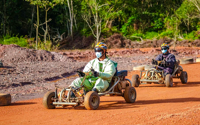 Go-karting on a dirt track at Batam Adventure Park.