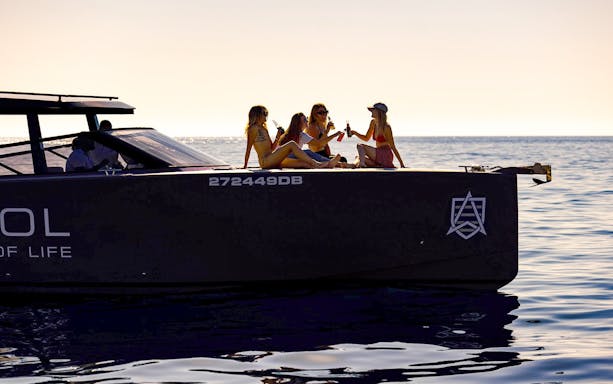 Guests toasting drinks on a boat in Dubrovnik.
