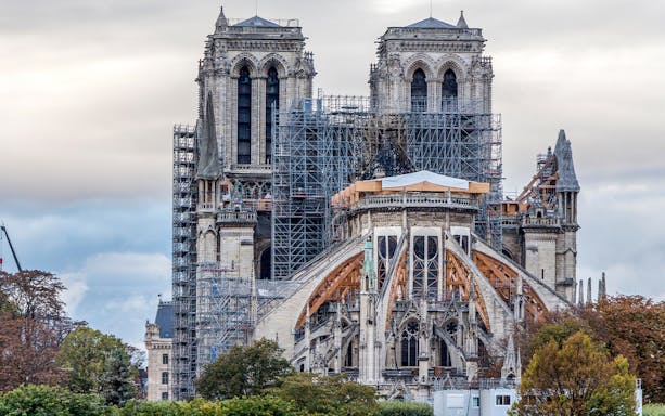 Notre Dame Cathedral facade with scaffolding during restoration in Paris, France.