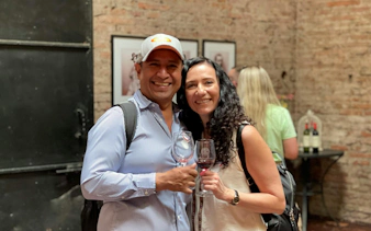 Tourists enjoying wine tasting at Cousiño Macul winery in Santiago, Chile.