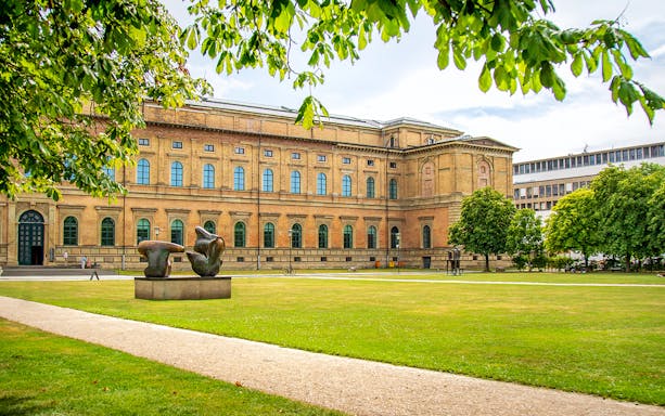 Alte Pinakothek exterior with sculpture in Munich, Germany.