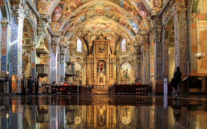 San Nicolas Church interior with ornate frescoes and gilded altar, Valencia, Spain.
