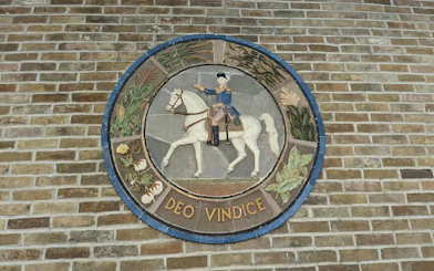 Mosaic of a rider on a horse with "Deo Vindice" inscription, San Antonio exploration game.