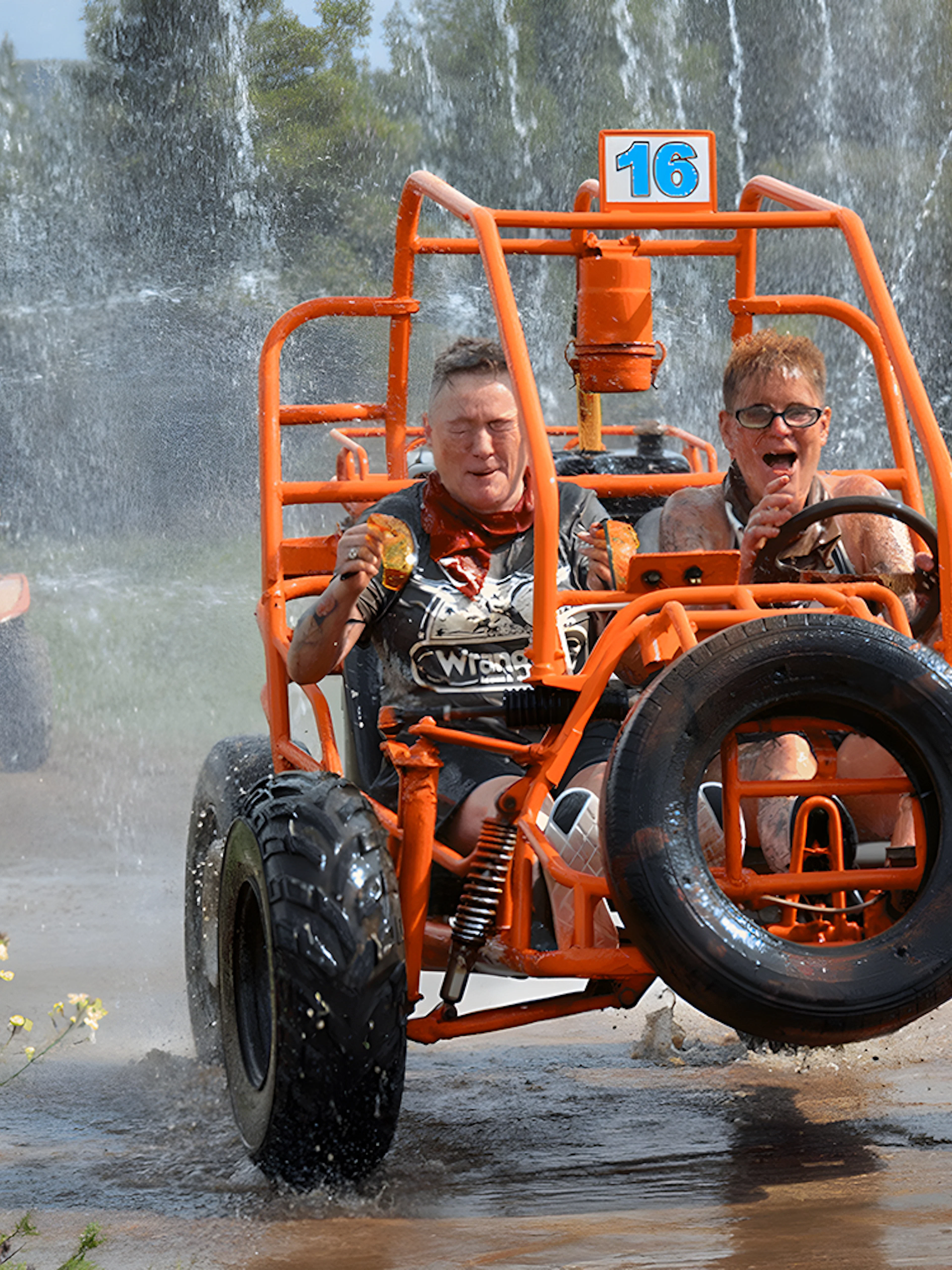 Participants driving through water on Alanya Buggy Safari tour.