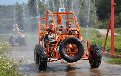Participants driving through water on Alanya Buggy Safari tour.