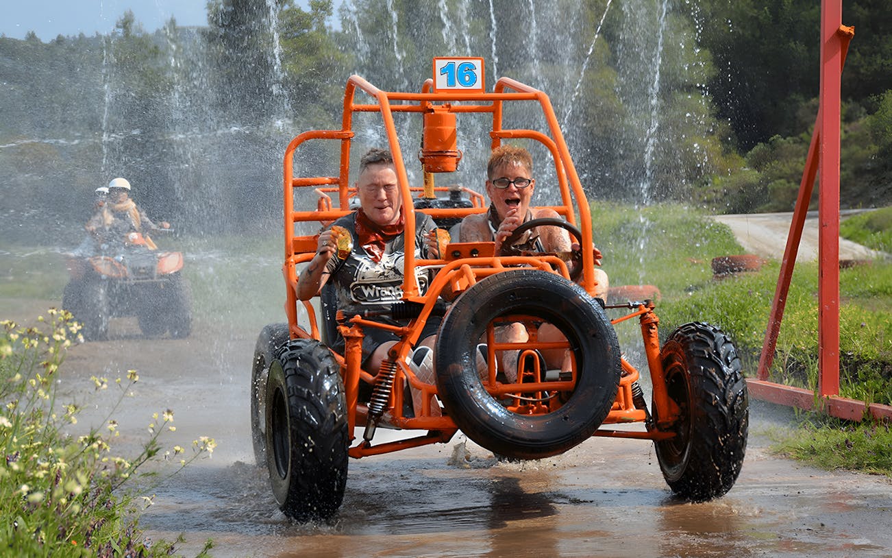 Participants driving through water on Alanya Buggy Safari tour.