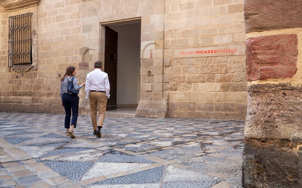 Visitors entering the Picasso Museum in Malaga, Spain.