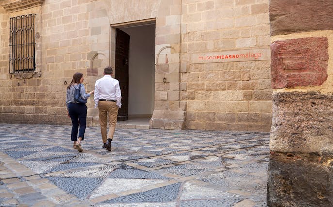 Visitors entering the Picasso Museum in Malaga, Spain.