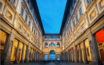 Uffizi Gallery courtyard in Florence at dusk, part of the Haunted Florence exploration game.