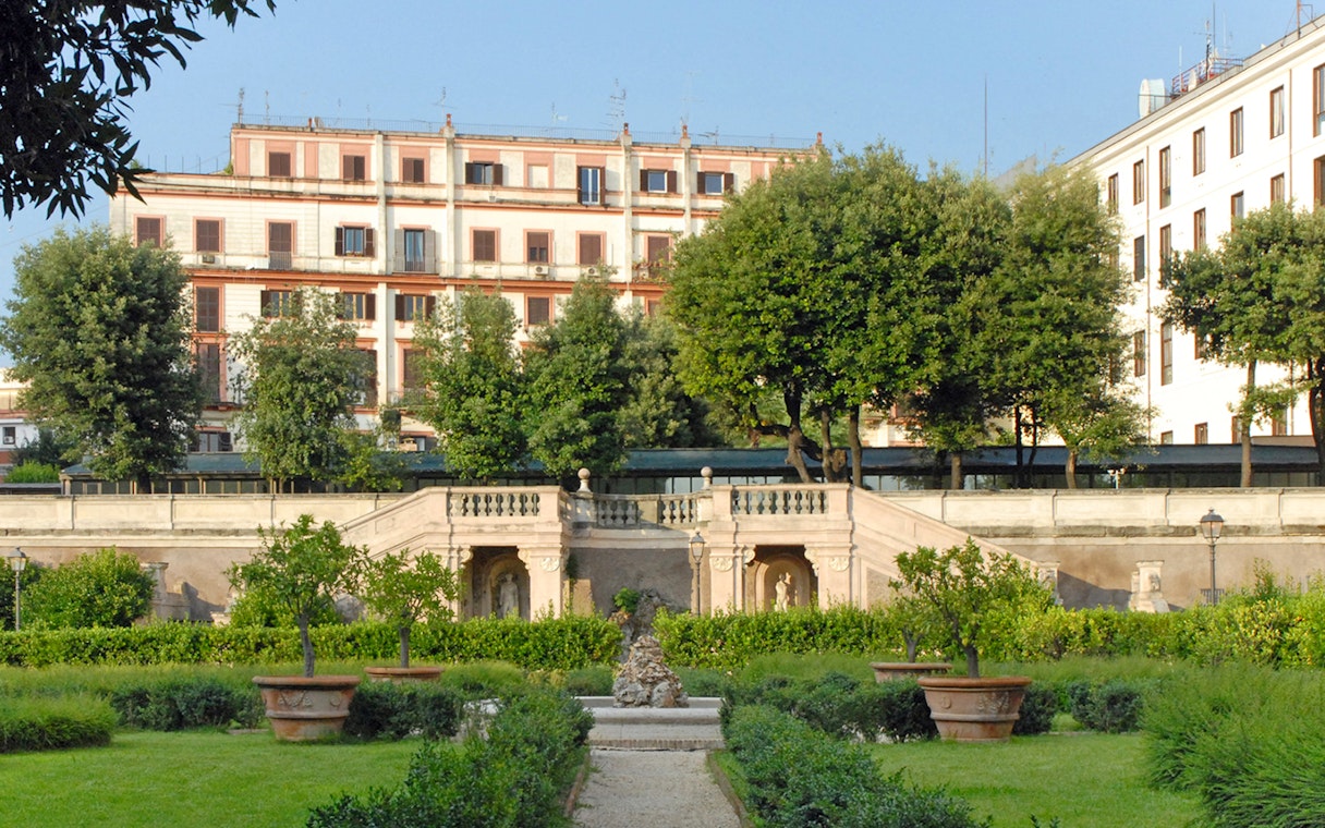 Palazzo Barberini exterior with garden and staircase in Rome, Italy.