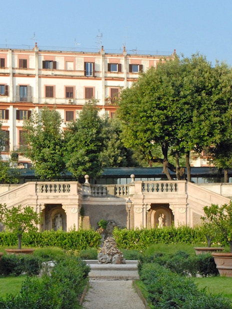 Palazzo Barberini exterior with garden and staircase in Rome, Italy.