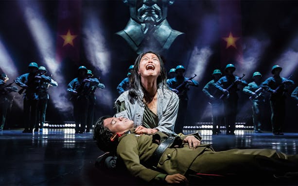 Actors performing a dramatic scene in Miss Saigon at Sydney Opera House.