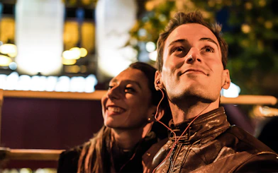 Man enjoying audio guide on Dublin night tour.