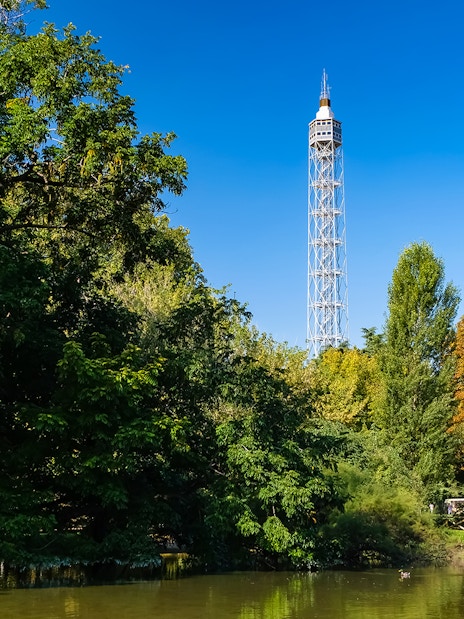 Torre Branca rising above lush trees in Milan's Sempione Park.