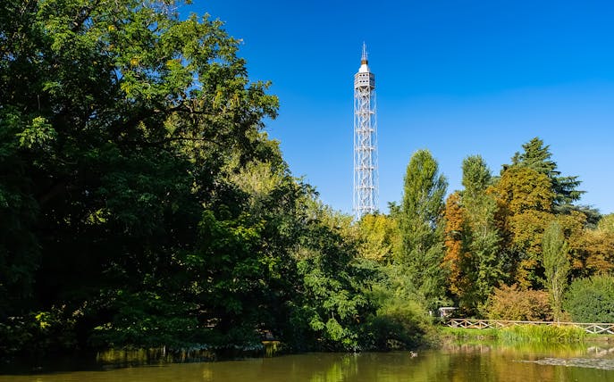 Torre Branca rising above lush trees in Milan's Sempione Park.