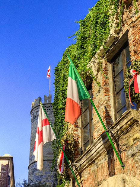 Casa di Colombo with Italian and Genoese flags, Genoa, Italy.