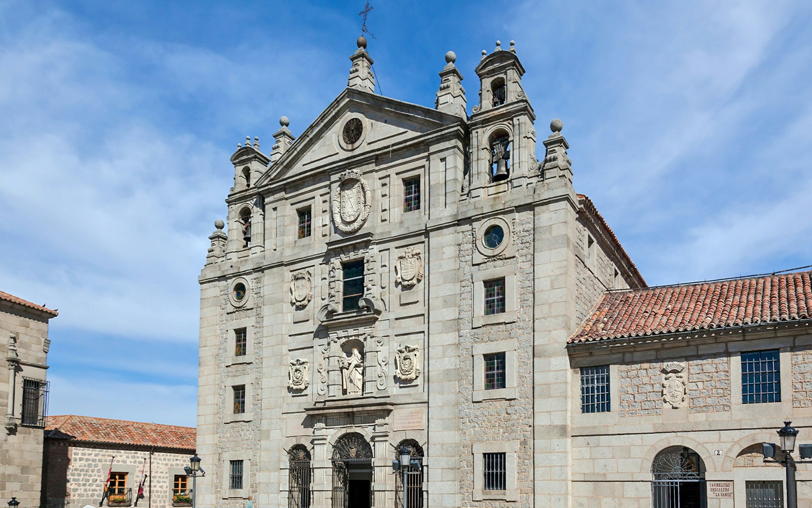 Church of St Teresa of Avila facade in Madrid with intricate architectural details.