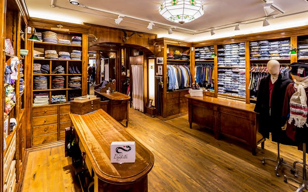 Sardinian clothing display in Bagella Brothers store, showcasing traditional garments and accessories.