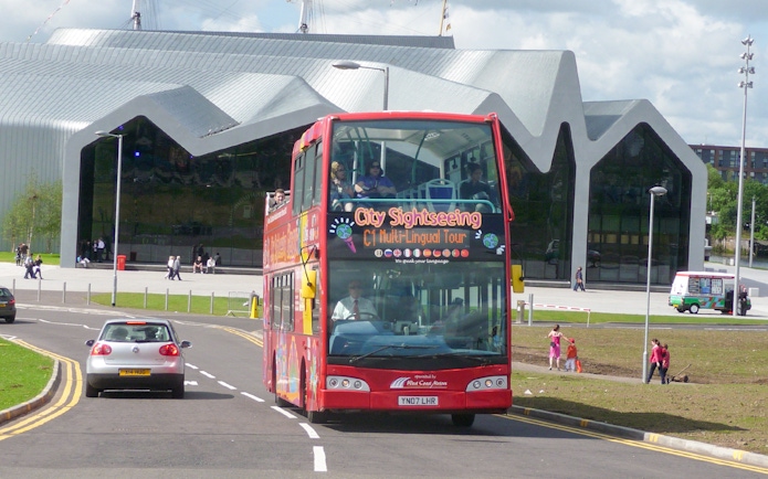 Citysightseeing tour bus in front of Riverside Museum, Glasgow.