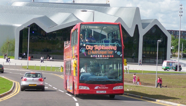 Citysightseeing tour bus in front of Riverside Museum, Glasgow.