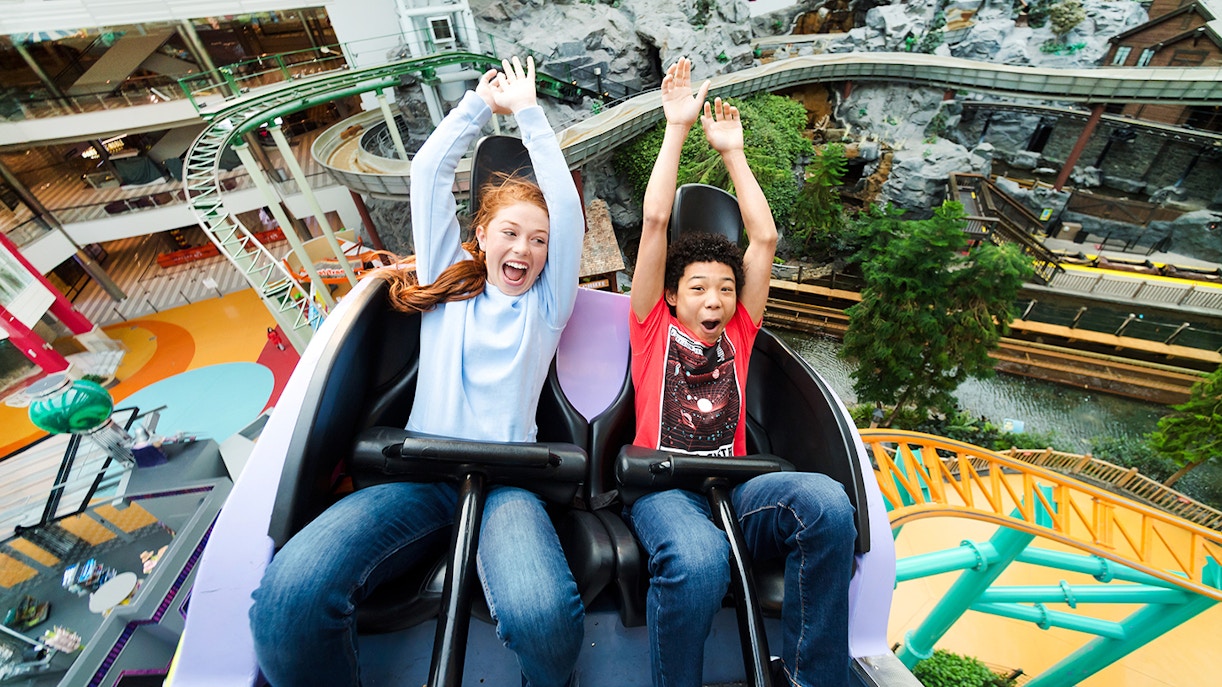 Guests enjoying a roller coaster ride at Nickelodeon Universe, Mall of America.