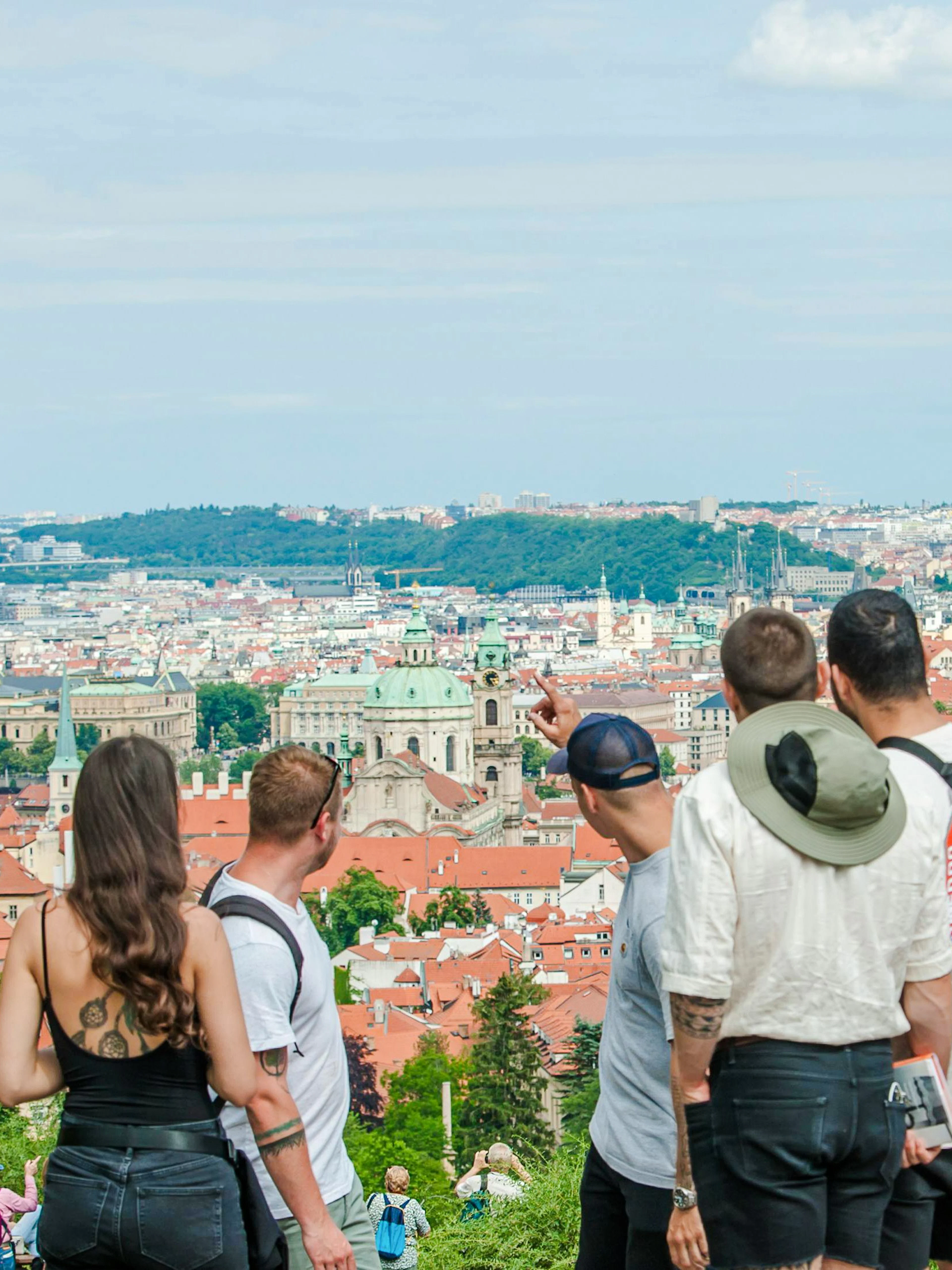 Guests overlooking Prague cityscape near The Prague Castle.
