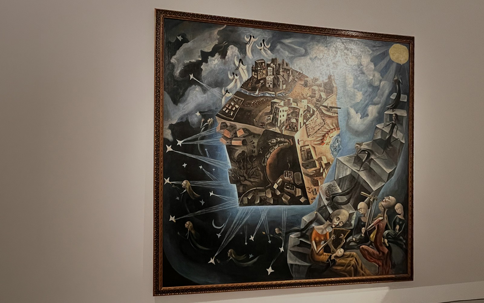 Ángeles Santos’s "A World" painting at Reina Sofia Museum, depicting a surreal cityscape and celestial figures.