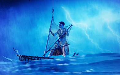 Performer on a boat in Varuna Underwater Theatrical Dining Experience.