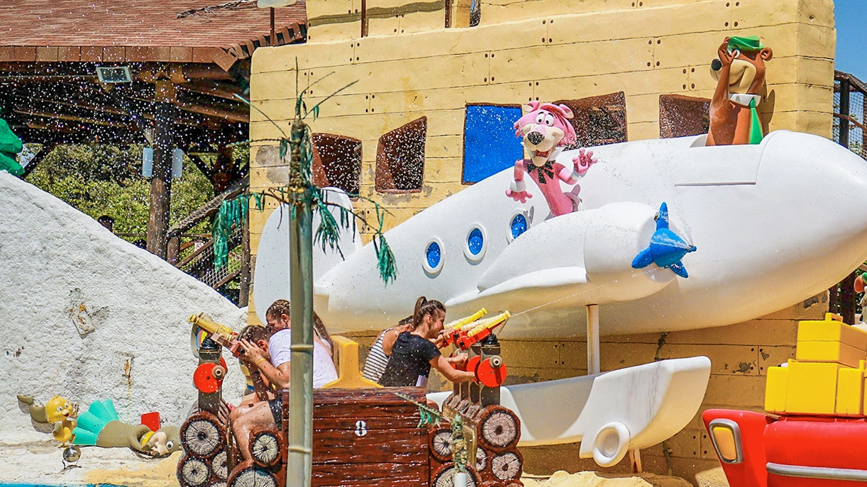 Children enjoying roller coaster ride at Parque Warner Madrid.