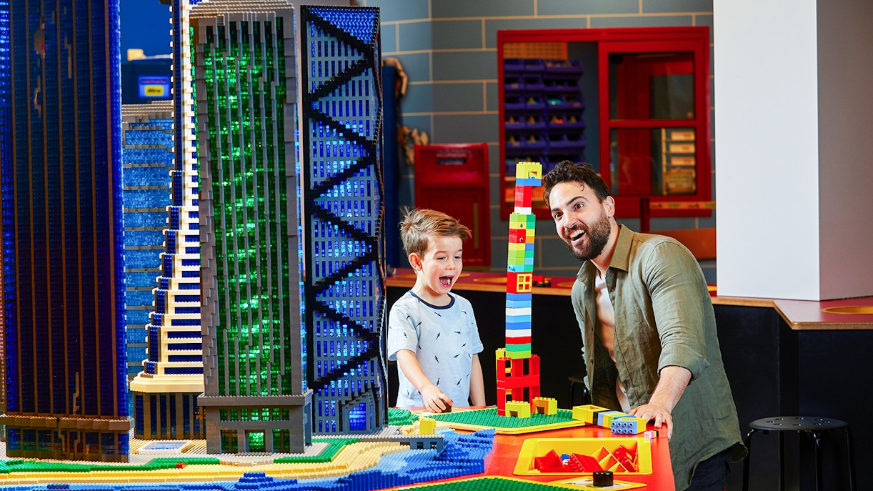 Family building Lego structures at Legoland Melbourne.