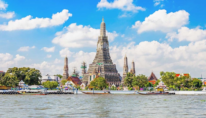 Wat Arun temple on the banks of the Chao Phraya River in Bangkok