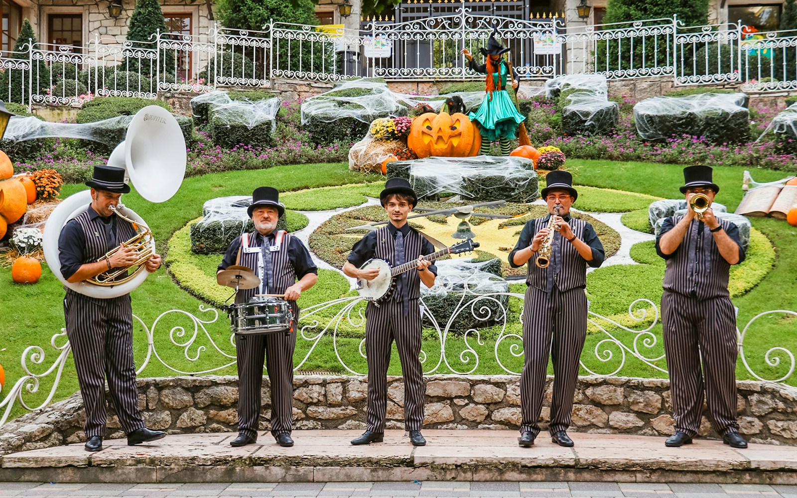 Crowd enjoying thrilling rides and spooky performances at Gardaland Halloween event in Italy