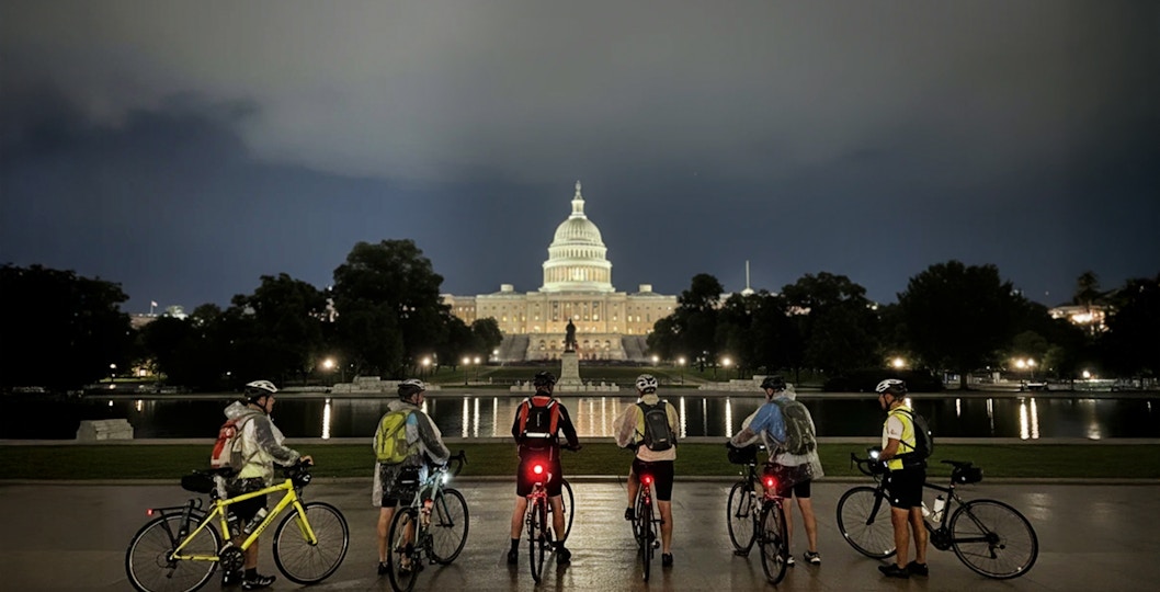 Tourists with bikes in front of the Capitol Building at night, Washington D.C.