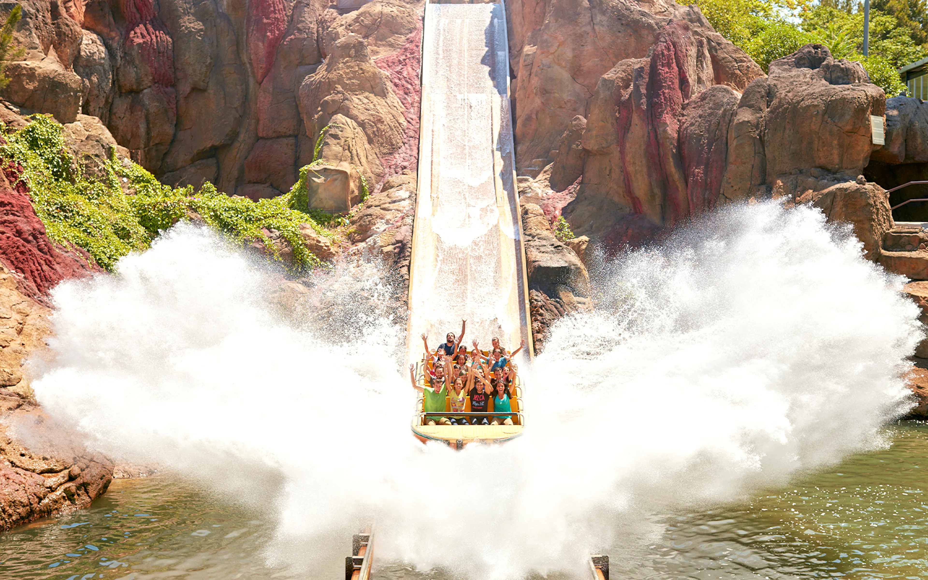 People enjoying a water ride splash at PortAventura World, Barcelona.