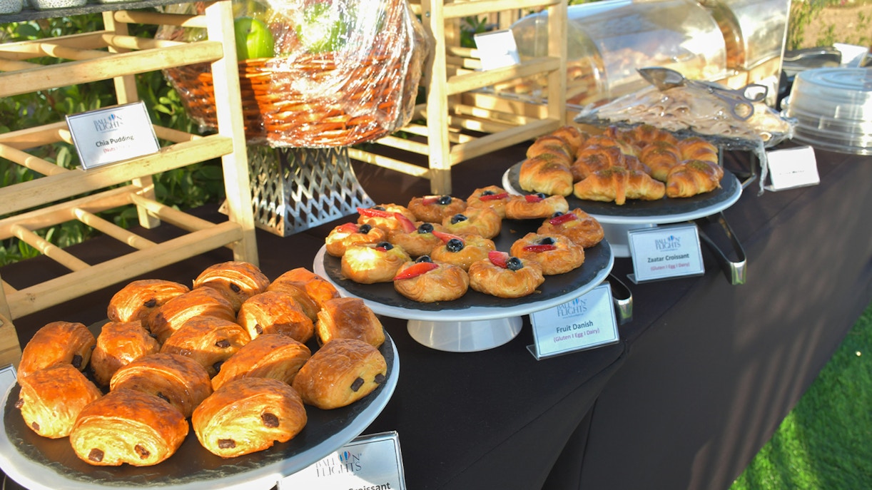 Assorted pastries on display for hot air balloon experience breakfast.