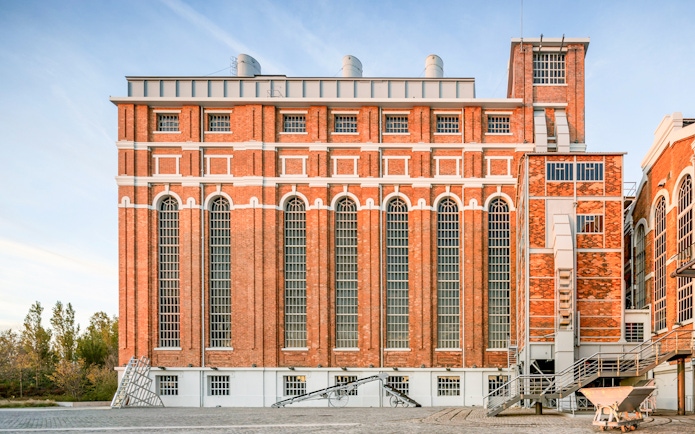 MAAT Gallery exterior with red brick facade in Lisbon, Portugal.