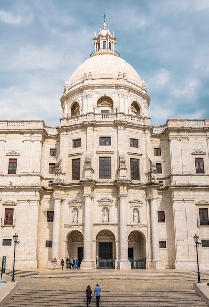National Pantheon facade in Lisbon with visitors on steps.