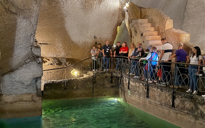 Visitors exploring Bourbon Gallery in Naples underground.