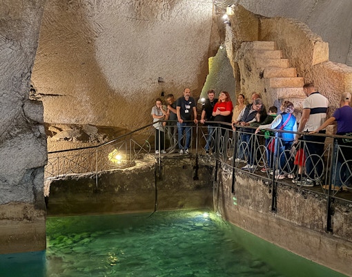 People exploring Bourbon Gallery in Naples underground.