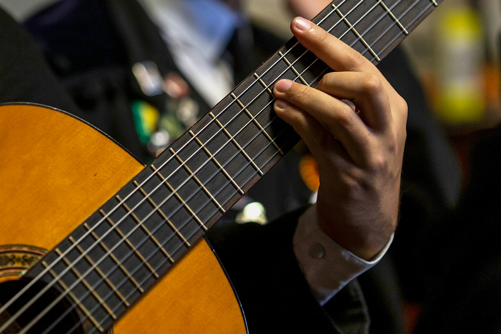 Guitarist playing during a Flamenco show with premium sherry cocktails.
