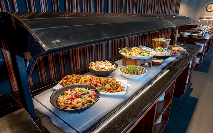 Buffet setup at Te Puia geothermal park featuring traditional Hāngī dishes.