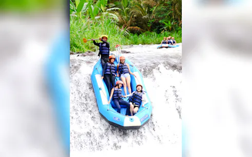 Rafting group navigating rapids on Telaga Waja River, East Bali.
